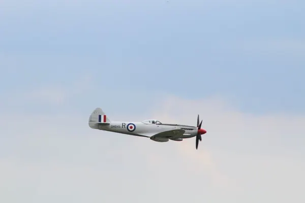 Supermarine Spitfire in flight with RAF roundels on its wings