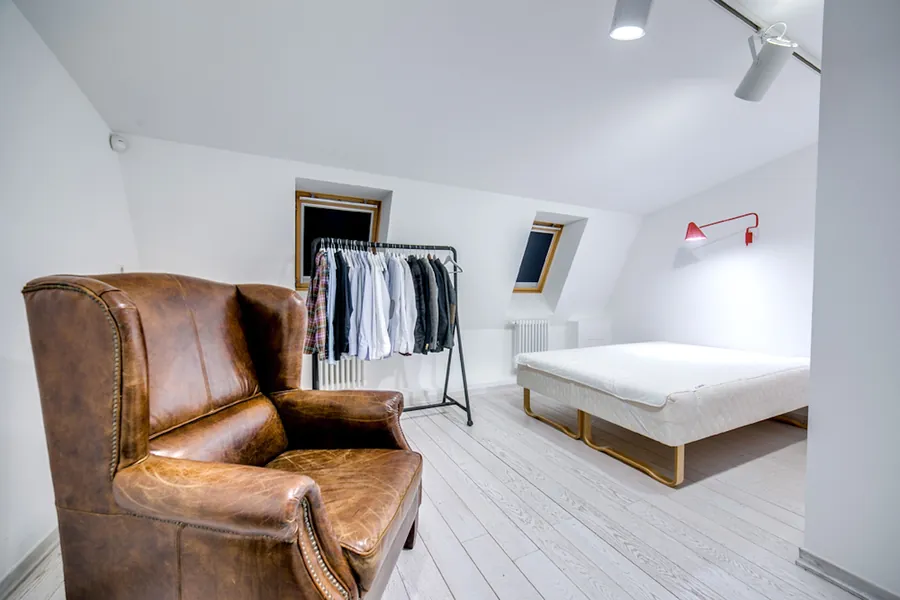 Converted loft bedroom with rooflights fitted into the roof slope