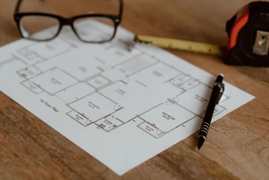 Loft conversion plans and drawings laid out with a tape measure and pencil