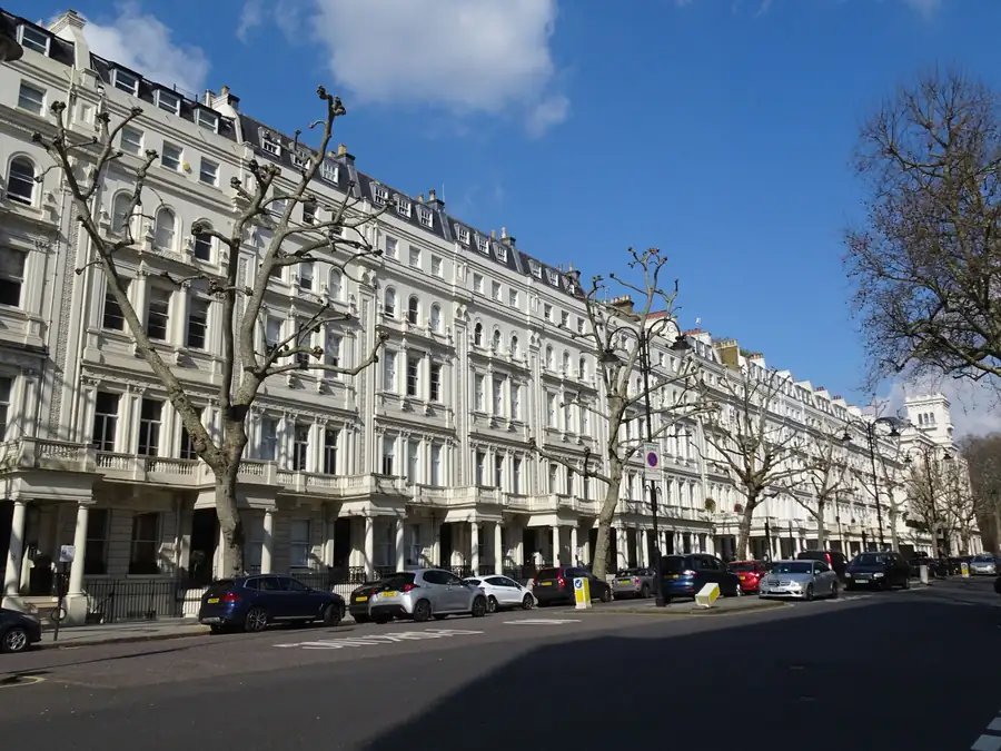 Mansard roof extensions added over decades along a London terrace, much of it built before anyone kept the paperwork