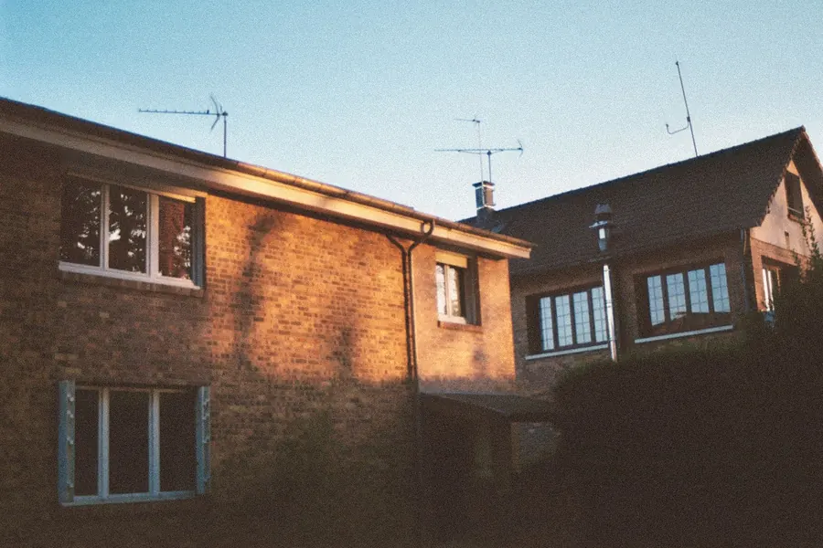Postwar brick houses with TV aerials on the roofs, the kind of estate housing found across Bedfont and Feltham