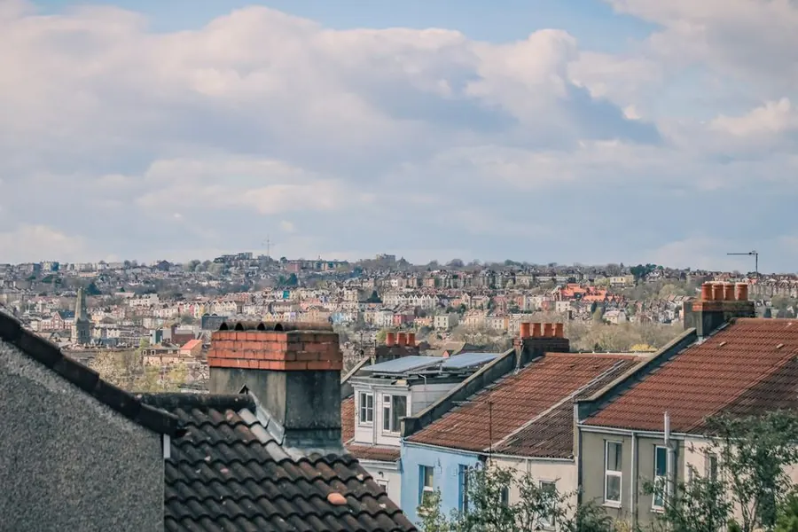 Redundant brick chimney stacks across suburban rooftops in west London