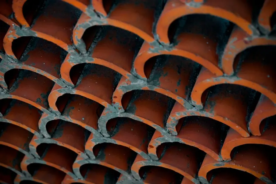 Overlapping clay roof tiles seen in close detail