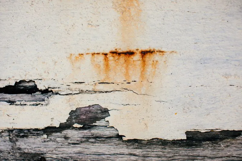 Brown water staining spreading across a bedroom ceiling in a Hounslow home