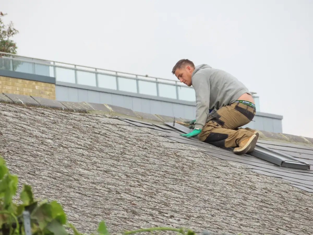 New rubber membrane being fitted to the flat roof of a rear extension in Hounslow