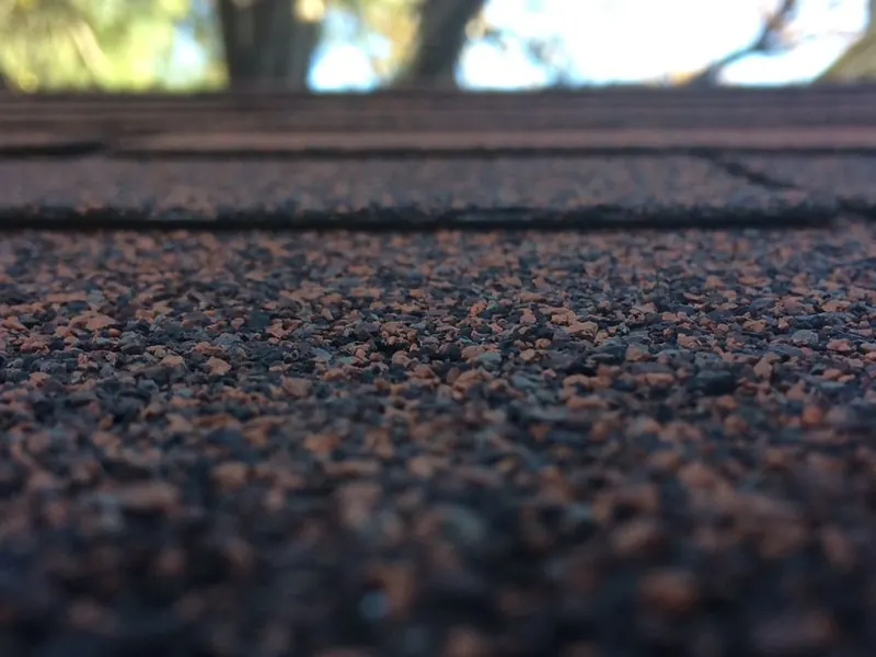 Mineral felt surface of a flat garage roof, seen up close