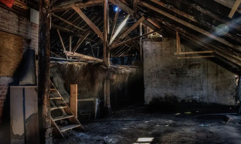 Old roof timbers inside a dark west London loft