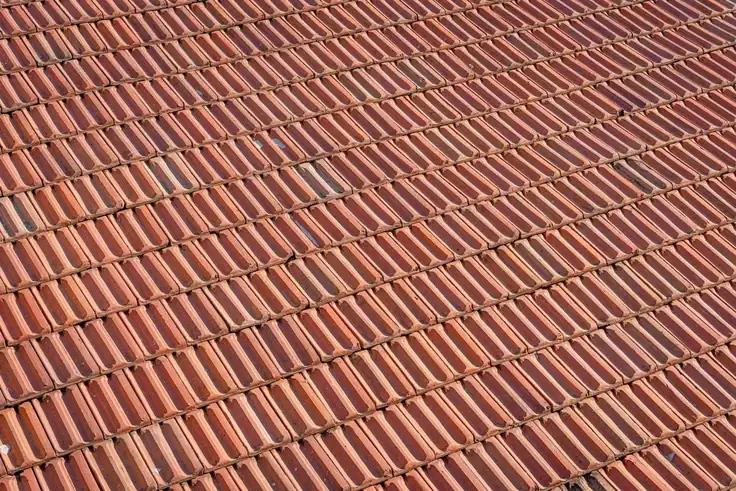 Newly laid clay tiles across the roofs of a west London street