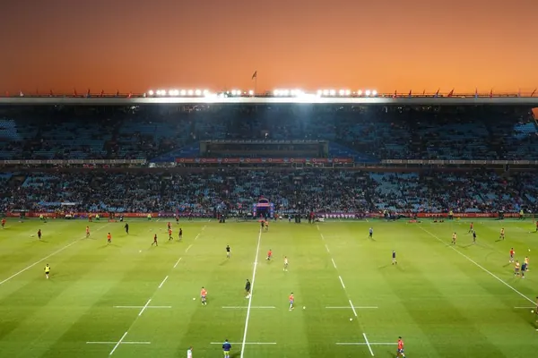 Vast sports stadium bowl filled with spectators on an event day